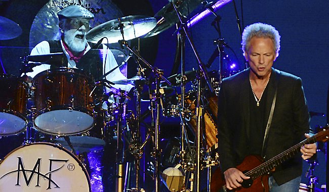 Mick Fleetwood plays the drums and Lindsey Buckingham plays the guitar as Fleetwood Mac performs at Target Center. (Pioneer Press: John Autey) Mick Fleetwood plays the drums and Lindsey Buckingham plays the guitar as Fleetwood Mac performs at Target Center. (Photo: John Autey / Pioneer Press) 