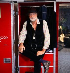 Mick Fleetwood sitting on case