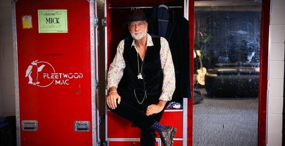 Mick Fleetwood sitting on case