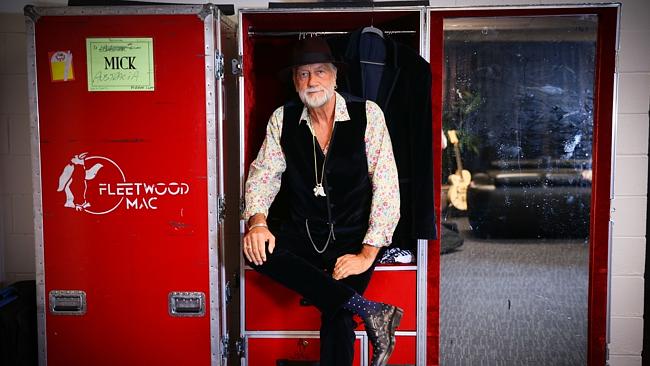 Mick Fleetwood sitting on case