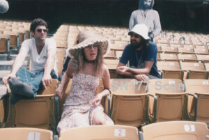Fleetwood Mac sitting in stadium